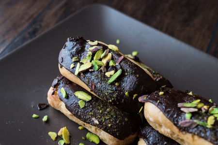 Chocolate Eclairs / Donut with pistachio powder