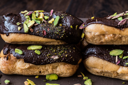 Chocolate Eclairs / Donut with pistachio powderの写真素材