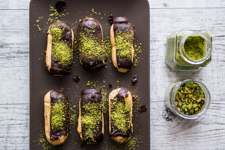 Chocolate Eclairs / Donut with pistachio powder
