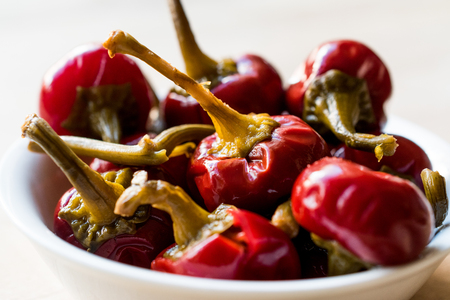 Pickled Cherry Pepper Pickles in bowl. Organic Food.の写真素材