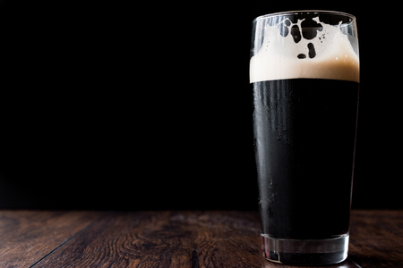 Dark beer on wooden surface. copy space. Beverage Concept.の写真素材