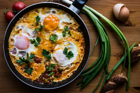 Menemen is a traditional Turkish dish which includes eggs, tomato, green peppers, and spices such as ground black pepper, ground red pepper, salt and oregano.の写真素材