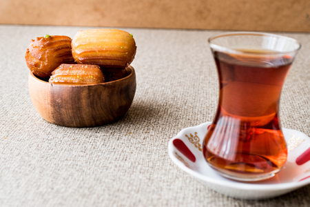 Turkish Dessert Tulumba tatlisi with tea. dessert concept.の写真素材