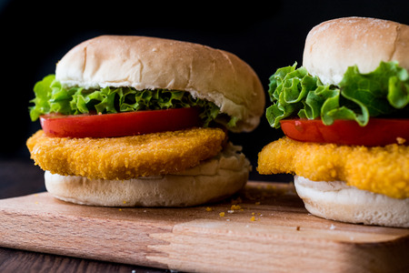 Chicken Burger with tomatoes and lettuce. Fast food concept.の写真素材