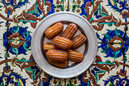 It is a fried batter soaked in syrup, similar to jalebis and churros.の写真素材