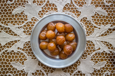 It is a fried batter soaked in syrup, similar to jalebis and churros.の写真素材