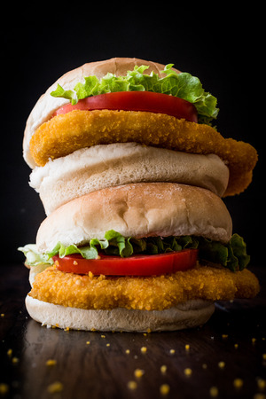 Stack of Chicken Burgers with tomatoes and lettuce. Fast foodの写真素材