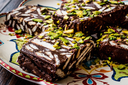 Mosaic Chocolate and Biscuit Cake with pistachio. Dessert Concept.の写真素材