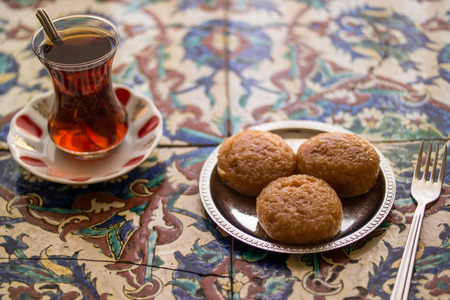 Kemalpasa dessert is prepared from a dough of flour, unsalted cheese, semolina, egg, water and baking powder.の写真素材