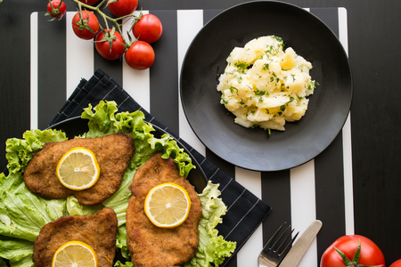 potato salad with schnitzel at restaurant.の写真素材
