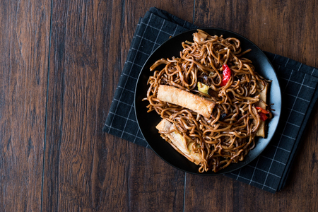 Veggie Noodle with Tofu and Red Peppers on Black Plate. Traditional Food.の写真素材