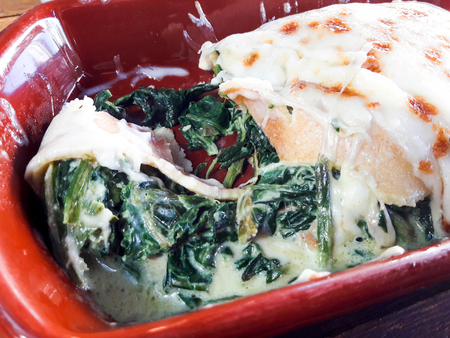 Baked Spinach Crepe with Cheese and Cream at Restaurant. Organic Food.の写真素材