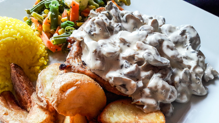 Chicken with mushrooms, cream and vegetables. Organic Food.の写真素材