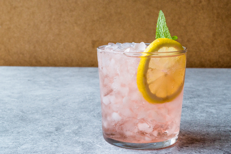 Pink Cocktail with Crushed Ice, Mint and Lemon. Beverage Concept.の写真素材