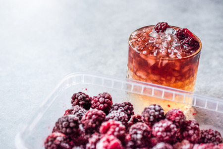 Bramble Cocktail with Blackberries and Crushed Ice. Beverage Concept.の写真素材