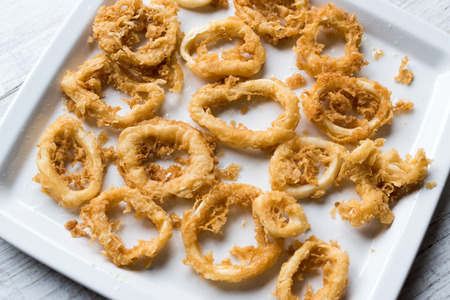 Fried Crispy Calamari Squid Rings with Tartar Sauce and Lemon. SeaFood Concept.