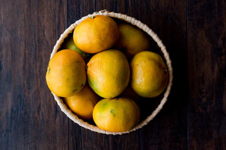 Fresh Organic Mandarin Oranges / (Dark Moody Background). Organic Food.の写真素材