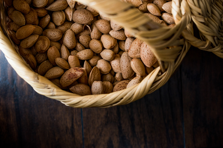Fresh Organic Raw Almonds with Shell in Basket. Organic Food.の写真素材