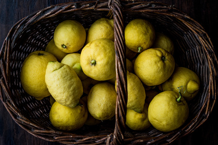 Organic Lemons in basket from garden. Organic food concept.の写真素材