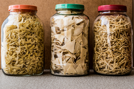Raw spaghetti ravioli and noodle in glass bottle. Organic Food Concept.の写真素材