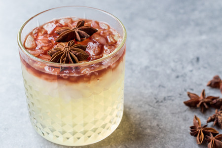 Gin Sour Red Wine Cocktail with Anise Star. Beverage Concept.