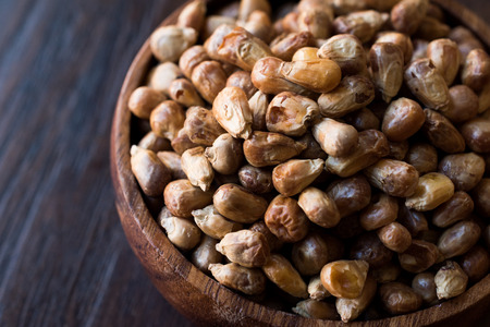 Turkish Snacks Kavurga / Fried Corn Seeds in Wooden Bowl. Organic Food.の写真素材