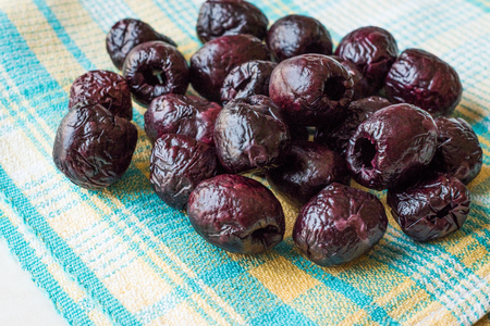 Dried Black Olive Chips / Crackers without seeds on Tablecloth. Organic Appetizerの写真素材