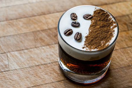 White Russian Cocktail with coffee beans. Beverage concept.