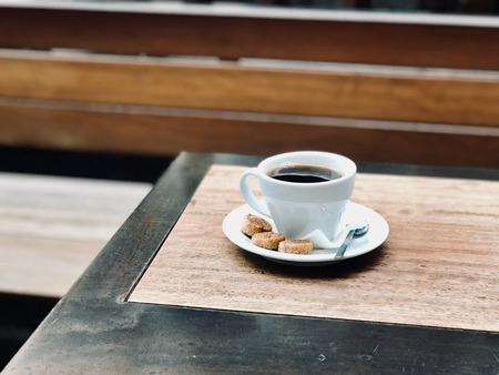 Fresh Filter / Filtered Coffee with Bubbles and small cookies at street in Cafe Shop