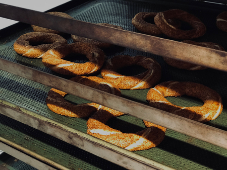 Turkish Pastry Bagel Simit on Tray. Traditional Bakery.の写真素材