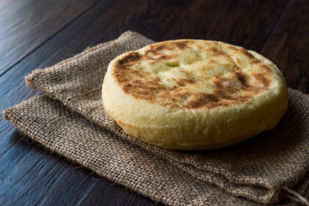 Turkish Flat Bread Bazlama on wooden surface. Traditional Bakeryの写真素材