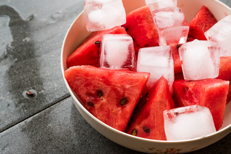 Watermelon Slices with Ice Cubes and Mint Leaves. Organic Summer Fruit.の写真素材