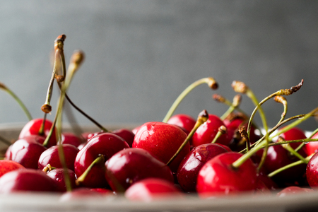 Raw Red Organic Cherries in Metal Collander. Organic Summer Fruit.の写真素材