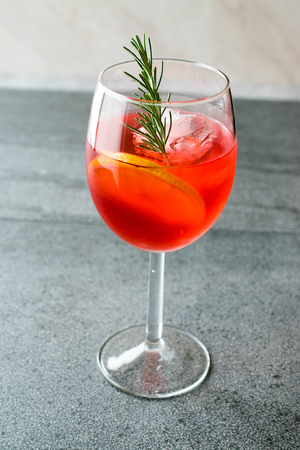 Aperol Spritz Cocktail with Orange Slice, Rosemary and Ice. Alcoholic Beverage.の写真素材