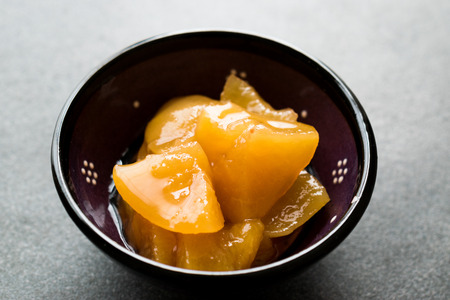 Peach Jam Marmalade with Fruit Pieces in Bowl. Organic Homemade Food.の写真素材