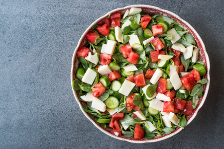 Purslane Salad with Goat Cheese, Cucumber and Tomatoes. Organic Fresh Food.の写真素材