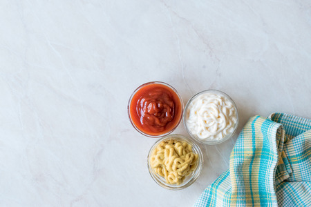 Set of Three Classic Sauce Ketchup, Mayonnaise and Mustard in Small Glass Bowls. Fast Food Sauce.