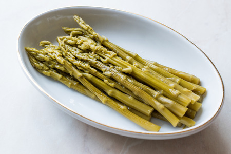Pickled Green Asparagus Pickles Fermented and Preserved in Plate. Organic Food.の写真素材