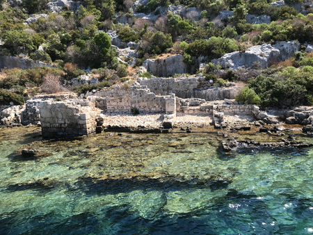 Kayakoy Kekova(Simena) village,Fethiye,Mugla Sunken city of Kekova in bay of Ucagiz view from sea in Antalya province of Turkey with turqouise sea rocks and ancient cityのeditorial素材