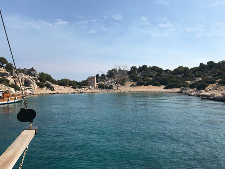 Antalya, Turkey - February 23, 2018: Sunken city of Kekova in bay of Ucagiz view from sea in Antalya province of Turkey with turqouise sea rocks and ancient cityのeditorial素材