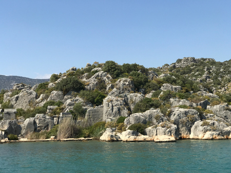 Kayakoy Kekova(Simena) village,Fethiye,Mugla Sunken city of Kekova in bay of Ucagiz view from sea in Antalya province of Turkey with turqouise sea rocks and ancient cityのeditorial素材
