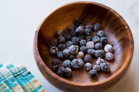 Black Raw Tapioca Pearls in Wooden Bowl. Organic Product.の写真素材