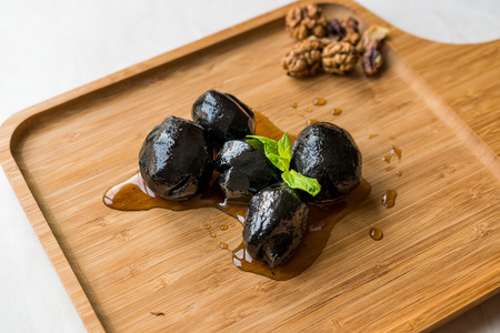 Turkish Dessert Walnut Jam with Mint leaves / Marmalade on Wooden Tray. Traditional Organic Food.の写真素材