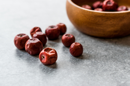 Red Jujube Fruits in Wooden Bowl / Hunnap / Organic Food.の写真素材