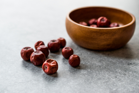 Red Jujube Fruits in Wooden Bowl / Hunnap / Organic Food.の写真素材