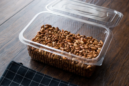 Organic Pistachio Nuts Without Shell in Plastic Box Container / Box. Organic Food.の写真素材