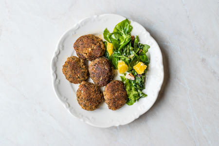 Homemade Salmon Meatballs Served with Orange Salad. Fast Food.の写真素材