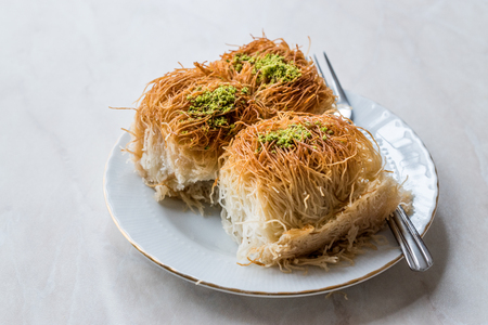 Homemade Turkish Dessert Fincan Kadayif Baklava / Baklawa with Pistachio Powder. Traditional Food.