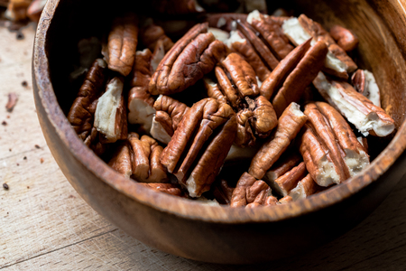 Peeled Pecan Nuts in Wooden Bowl without Shell / Walnuts. Organic Food.