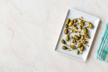 Pickled and Canned Capers Ready to Eat in Plate. Organic Food.